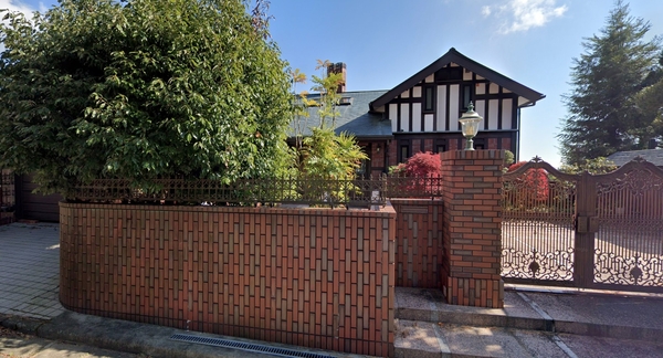 The Tudor-style house.